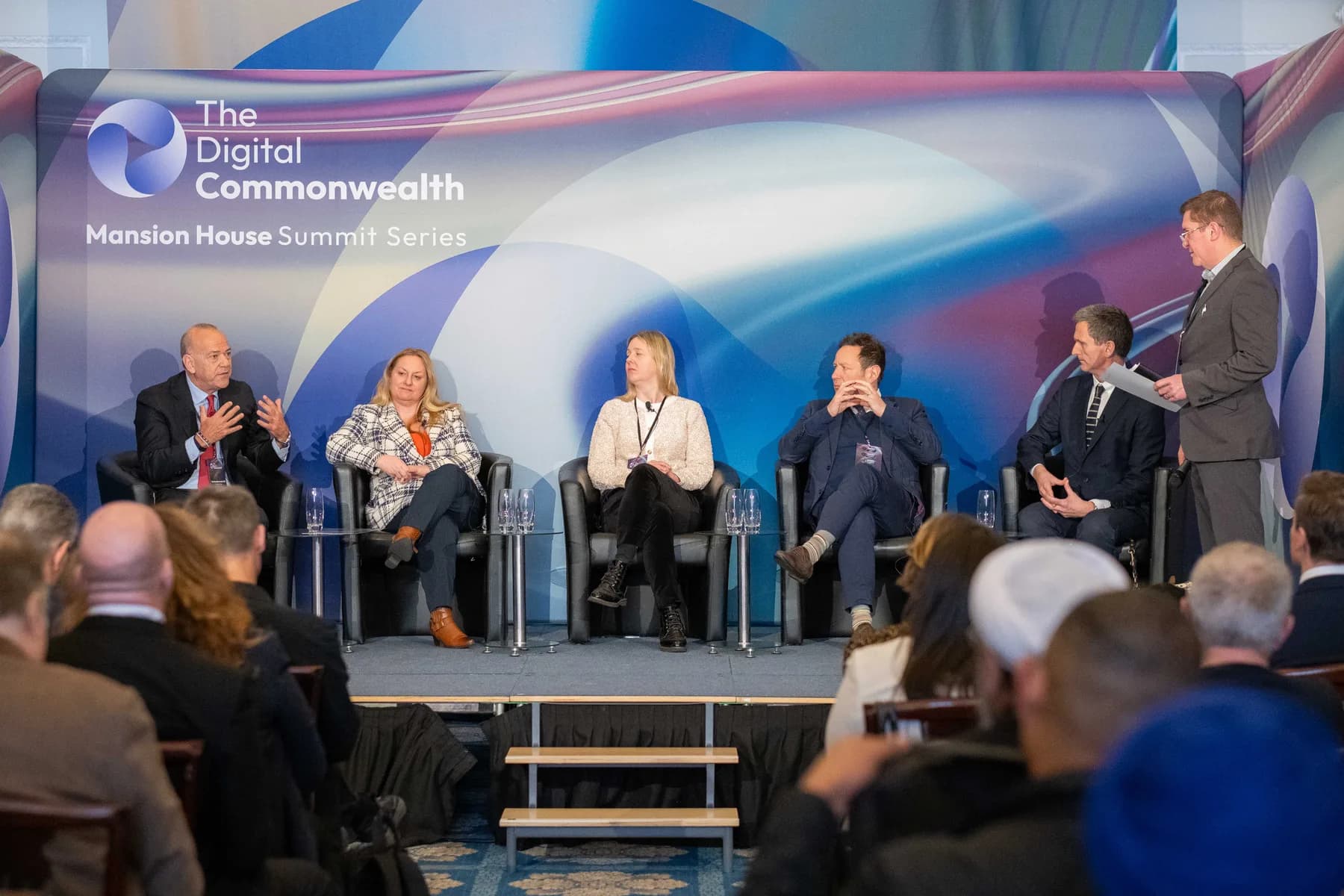 Panel discussion on stage at the Digital Commonwealth Summit